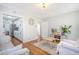 Spacious living room featuring hardwood floors and a view of the kitchen at 1328 Cottonwood St, Charleston, SC 29403