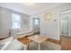 Bright living room with hardwood floors, white couch, and a view into the kitchen at 1328 Cottonwood St, Charleston, SC 29403