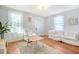 Cozy living room with hardwood floors, light walls and comfy seating at 1328 Cottonwood St, Charleston, SC 29403