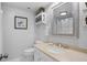 Clean bathroom with a beige countertop, white vanity, and a framed mirror at 1507 Marsh Haven, Seabrook Island, SC 29455