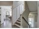 Modern staircase with white shiplap wall and dark wood steps at 1518 Old Rivers Gate Rd, Mount Pleasant, SC 29466