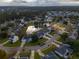 Aerial view of residential neighborhood with pond at 172 Sea Cotton Cir, Charleston, SC 29412