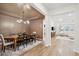 Formal dining room with a rustic wooden table and chandelier at 178 Garden Lily Ln, Summerville, SC 29485