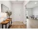 Light and airy entryway with hardwood floors and a view to the playroom at 178 Garden Lily Ln, Summerville, SC 29485