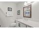 Small bathroom with white vanity, granite countertop, and mirror at 2264 Seascape Ct, Seabrook Island, SC 29455