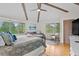 Relaxing main bedroom with hardwood floors, a ceiling fan, and views of the surrounding area at 2264 Seascape Ct, Seabrook Island, SC 29455