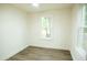 Simple bedroom with two windows and wood-look flooring at 2641 Ranger Dr, North Charleston, SC 29405