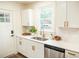 Clean kitchen with white cabinets, a farmhouse sink and a window at 2641 Ranger Dr, North Charleston, SC 29405