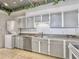 Kitchen with gray cabinets and granite countertops at 330 Concord St # 7 A, Charleston, SC 29401