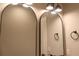 Bathroom with arched mirrors and modern lighting at 42 Summer Dr, Walterboro, SC 29488