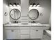 Modern bathroom boasts double sinks, granite countertops, and stylish light fixtures at 42 Summer Dr, Walterboro, SC 29488