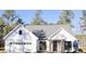 White farmhouse exterior with gray roof and a two-car garage at 42 Summer Dr, Walterboro, SC 29488