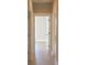 Bright hallway with light hardwood floors and neutral walls at 42 Summer Dr, Walterboro, SC 29488