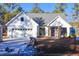 Newly constructed farmhouse with gray roof and landscaping at 42 Summer Dr, Walterboro, SC 29488