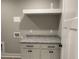 Laundry room with white cabinets and granite countertop at 42 Summer Dr, Walterboro, SC 29488