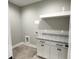Laundry room with white cabinets and granite countertop at 42 Summer Dr, Walterboro, SC 29488