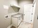 Laundry room with white cabinets and granite countertop at 42 Summer Dr, Walterboro, SC 29488