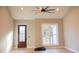 Spacious living room with hardwood floors and large windows at 42 Summer Dr, Walterboro, SC 29488