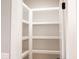 Bright white pantry with ample shelving at 42 Summer Dr, Walterboro, SC 29488