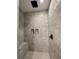 Spacious shower with gray marble-look tiles and built-in seat at 42 Summer Dr, Walterboro, SC 29488