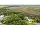 Aerial view showing home's location and waterfront access at 4591 Cape Island Dr, Awendaw, SC 29429