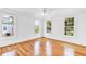 Bright bedroom with hardwood floors and multiple windows at 4591 Cape Island Dr, Awendaw, SC 29429