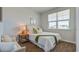 Well-lit bedroom with a full-size bed and green throw at 5540 Dalmore Dr, Ravenel, SC 29470