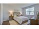Cozy bedroom with a queen-size bed and hardwood floors at 5540 Dalmore Dr, Ravenel, SC 29470