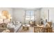 Bright living room featuring a comfy sofa and stylish decor at 5540 Dalmore Dr, Ravenel, SC 29470