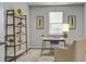 Home office with built-in shelving and a comfortable chair at 5540 Dalmore Dr, Ravenel, SC 29470