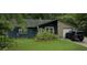 Ranch style home with blue siding, attached garage, and well-maintained lawn at 607 Mountain Pine Road, Moncks Corner, SC 29461