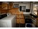 Small laundry room with washer, dryer, and wooden walls at 819 Misty Ridge Ln, Walterboro, SC 29488