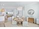 Elegant dining room with a round table, chandelier, and hardwood floors at 921 Governors Cay Cir, Charleston, SC 29492