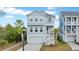 Two-story house with gray siding, white trim, and a garage at 921 Governors Cay Cir, Charleston, SC 29492