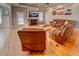 Large living room with stone fireplace and hardwood floors at 1007 Moss Haven Ln, Summerville, SC 29483