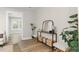 Bright entryway with console table, mirror, and lush potted plants at 105 Cobb Ct, Summerville, SC 29485