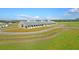 Aerial view of expansive equestrian property with large barn and riding arenas at 109 Peninsula Dr, Hollywood, SC 29470