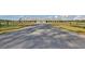 Long driveway leads to a stunning, expansive equestrian barn at 109 Peninsula Dr, Hollywood, SC 29470
