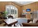 Relaxing lounge area in the barn with comfortable seating and kitchenette at 109 Peninsula Dr, Hollywood, SC 29470