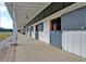 Modern barn with spacious stalls and a walkway at 109 Peninsula Dr, Hollywood, SC 29470
