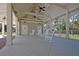 Covered patio with rocking chairs overlooking the pool at 109 Peninsula Dr, Hollywood, SC 29470