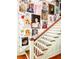 Staircase with gallery wall of portraits and floral wallpaper at 115 Briarwood Ln, Summerville, SC 29483