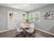 Bright dining area with white table and chairs, near the kitchen at 115 Sandy Dr, Moncks Corner, SC 29461