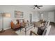 Living room with leather couch, coffee table, and wood-look floors at 115 Sandy Dr, Moncks Corner, SC 29461