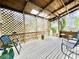 Relaxing back porch with wooden lattice and comfortable seating at 12 John St # Includes 8 & 10, Charleston, SC 29403