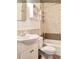 Clean bathroom with white vanity, shower/tub combo, and neutral tile at 12 John St # Includes 8 & 10, Charleston, SC 29403