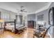 Gray bedroom with hardwood floors, fireplace and a comfy bed at 12 John St # Includes 8 & 10, Charleston, SC 29403