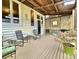 Inviting deck with metal chairs and flowering plants at 12 John St # Includes 8 & 10, Charleston, SC 29403