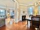 Elegant dining room features hardwood floors, a fireplace, and a charming chandelier at 12 John St # Includes 8 & 10, Charleston, SC 29403