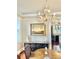 Well-lit dining room with hardwood floors, artwork, and chandelier at 12 John St # Includes 8 & 10, Charleston, SC 29403